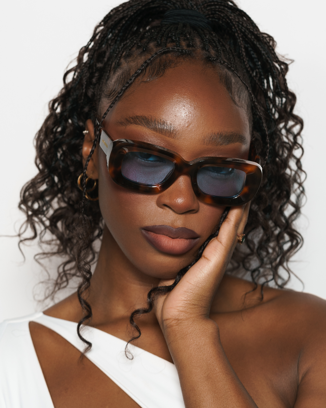 Model image of Rewrites tortoiseshell rectangular sunglasses: Handcrafted in Italy from 100% premium Mazzucchelli acetate, these tortoiseshell rectangular sunglasses feature a blue see-through TAC polarized lens for superior visual clarity and polarization. They include a scratch-resistant coating that blocks 100% harmful UV rays up to 400 nanometers. Highly impact-resistant and unisex, complete with our Rewrites logo in gold on the outside temples.